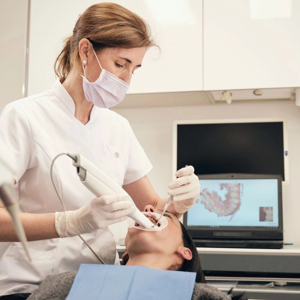 Dentist performing digital intra-oral scanning on a patient using advanced dental technology at Hanlon Creek Dental in Guelph, ON