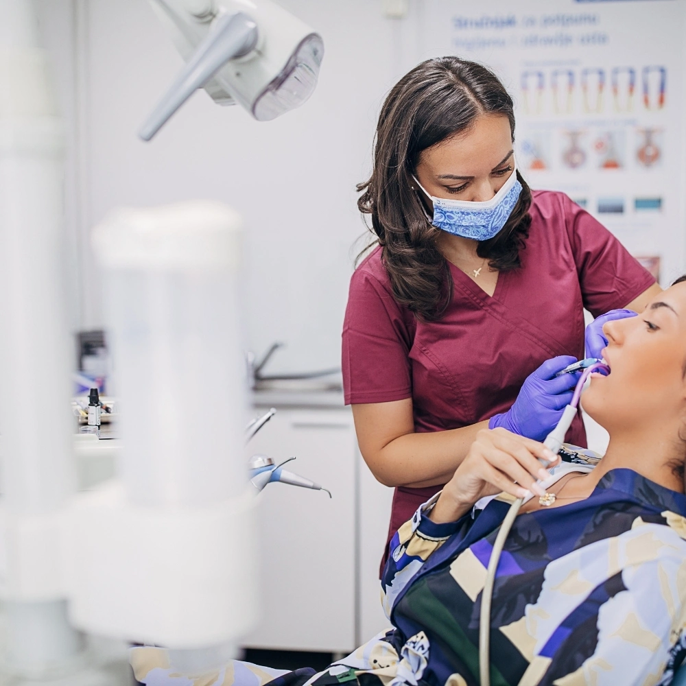Dentist providing urgent dental care to a patient during a dental emergency at Hanlon Creek Dental in Guelph, ON